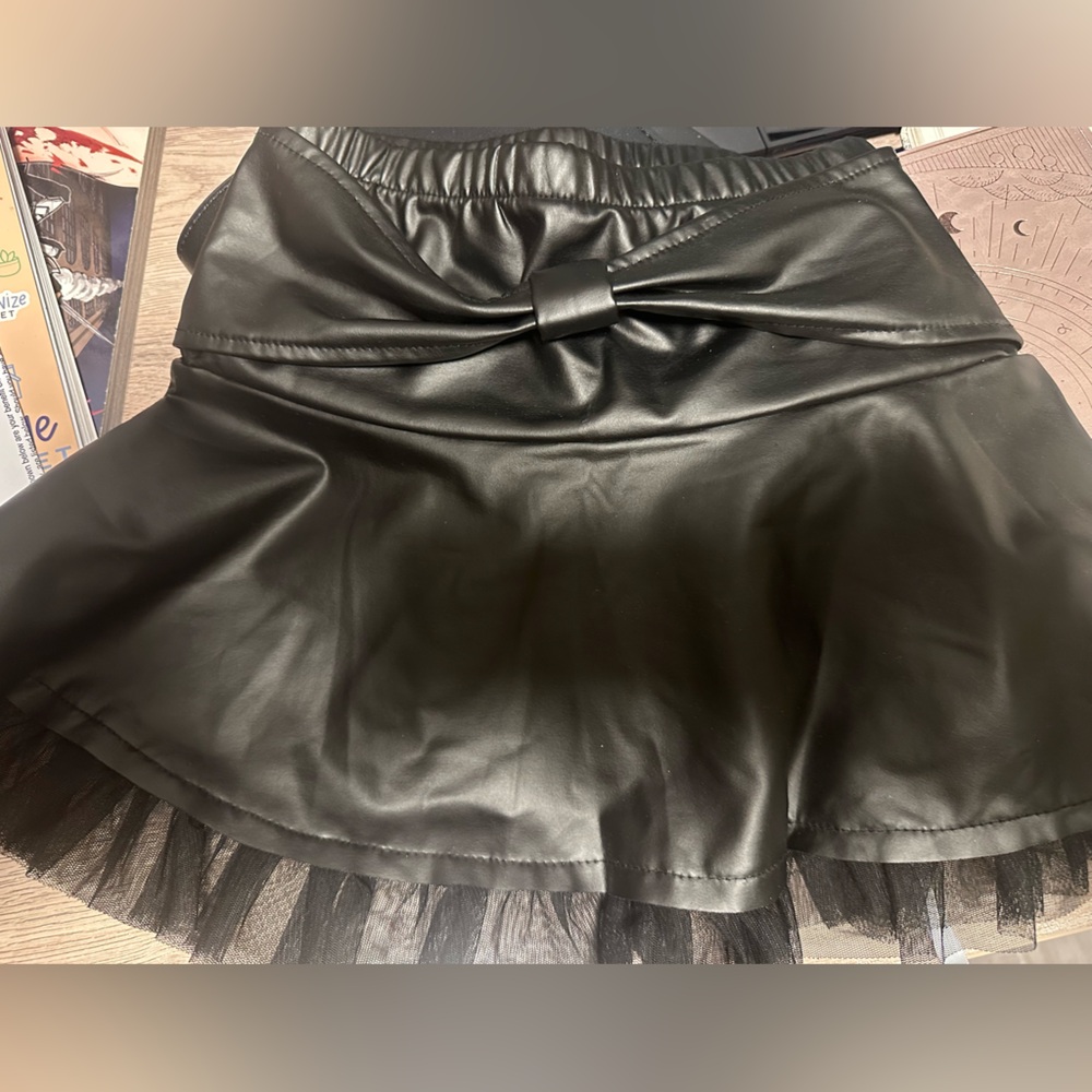 Girls black faux leather skirt with a tulle trim sz 4/5